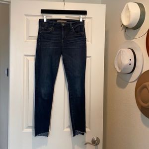 Joe’s Jeans skinny, frayed at the bottom, low rise, dark wash